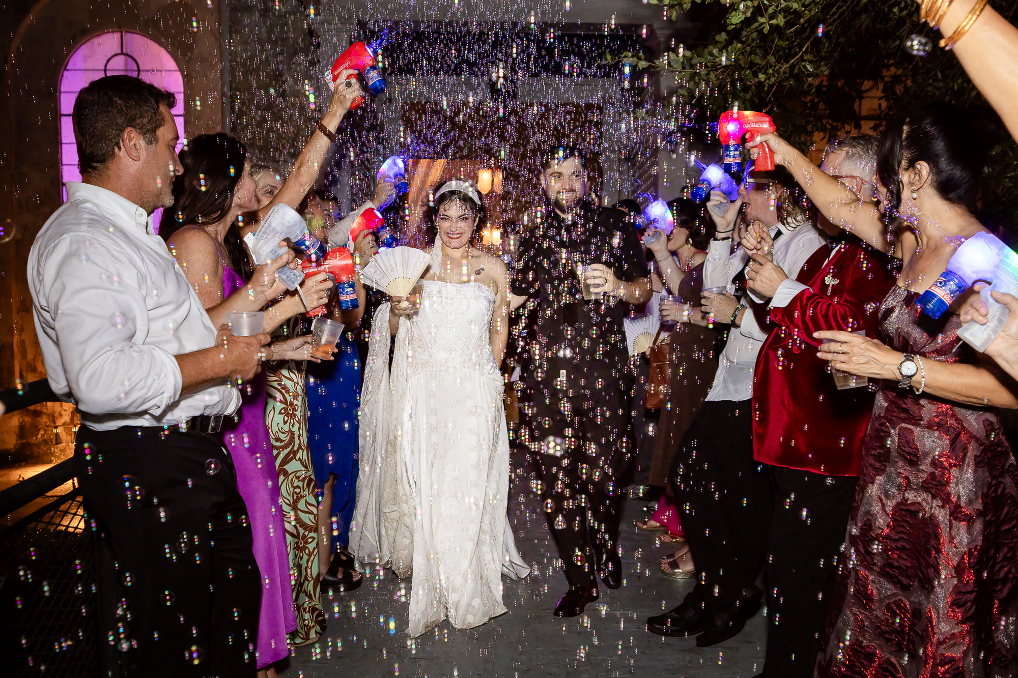 New Orleans Wedding at the Marigny Opera House. Bride & Groom exit with bubbles.